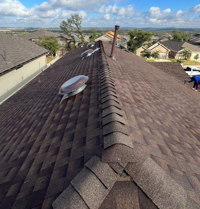 Revamped Roofing arial view of new residential home exterior renovations
